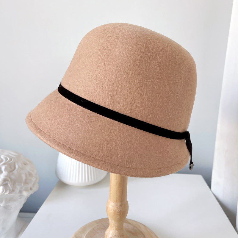 "Elegance Personified: Wool Felt Hats with Fine Bows for the Runway"