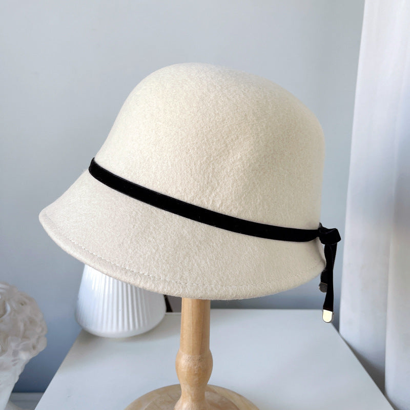 "Elegance Personified: Wool Felt Hats with Fine Bows for the Runway"