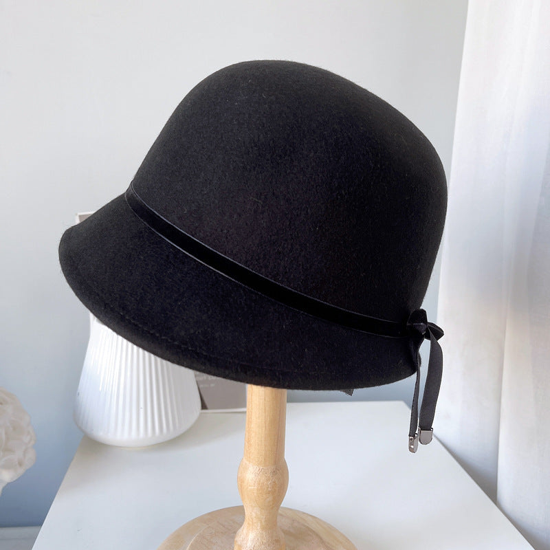 "Elegance Personified: Wool Felt Hats with Fine Bows for the Runway"