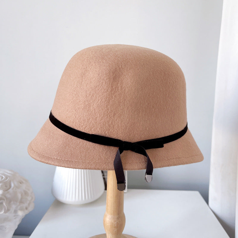 "Elegance Personified: Wool Felt Hats with Fine Bows for the Runway"