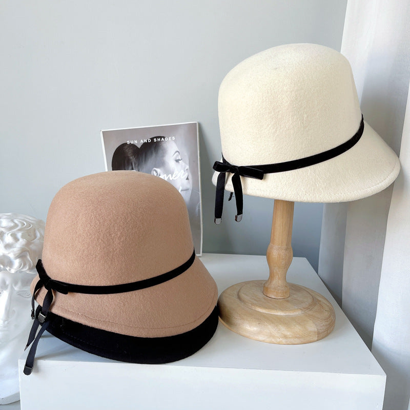 "Elegance Personified: Wool Felt Hats with Fine Bows for the Runway"