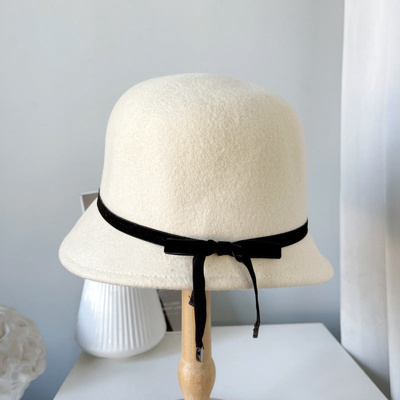 "Elegance Personified: Wool Felt Hats with Fine Bows for the Runway"